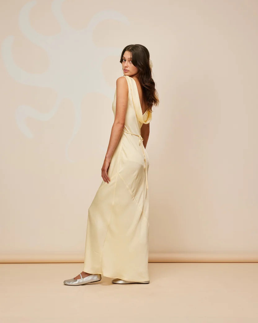 Model showcasing back of Firebird Cowl Gown in Butter - rent with Lend the Label designer rentals