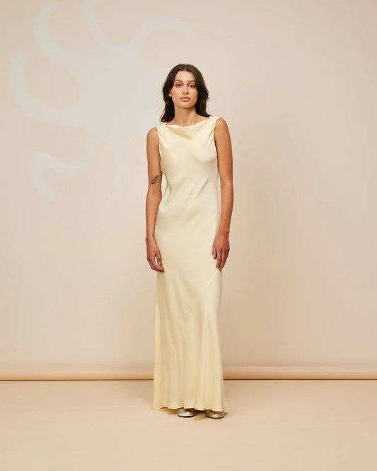 Model wearing our Firebird Cowl Gown in Butter - designer dress rental NZ