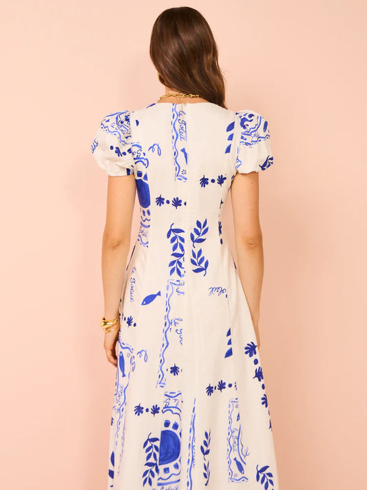 Back view of model wearing Wavy Maxi Dress in Le Soleil showcasing the blue and white print - Designer Dress Rental from Lend the Label