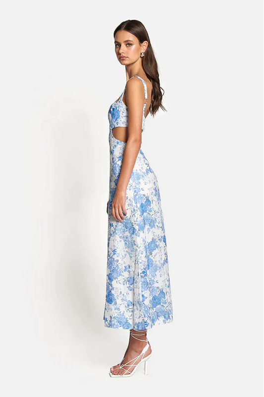 Model wearing Delilah Cut Out Midi in Sky Blue Floral, showing side on view - Designer Dress Rental from Lend the Label