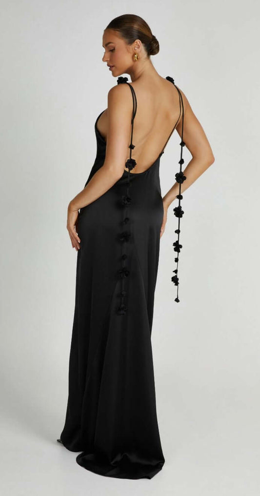 Model shows back of Elenora gown's - luxurious satin fabric and intricate floral details create a look that is both sophisticated and unique.