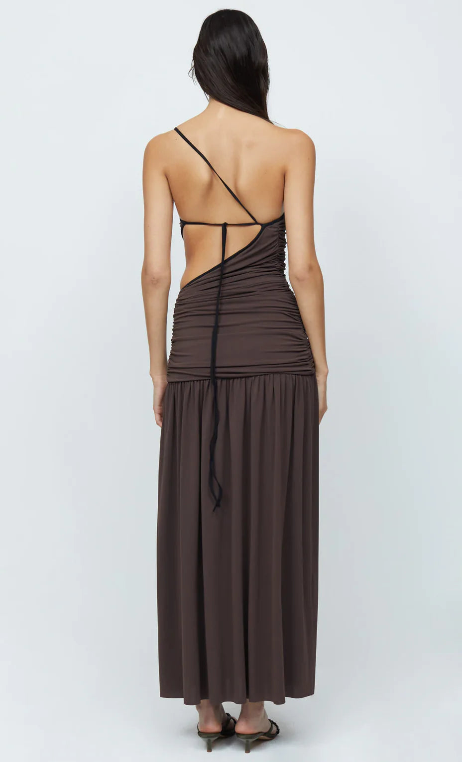 Back view of the Lena Maxi Dress featuring a fitted bodice, side cut-outs, and a flowy maxi-length skirt.