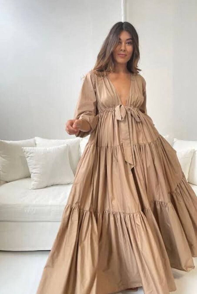 A Winters Tale Dress in Tan, featuring a bow-tie and flared design, perfect for special occasions.