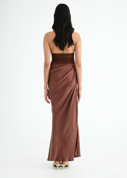 Back view of the Gina Maxi Dress showcasing elegant halter mesh top and stylish cupro skirt in brown.