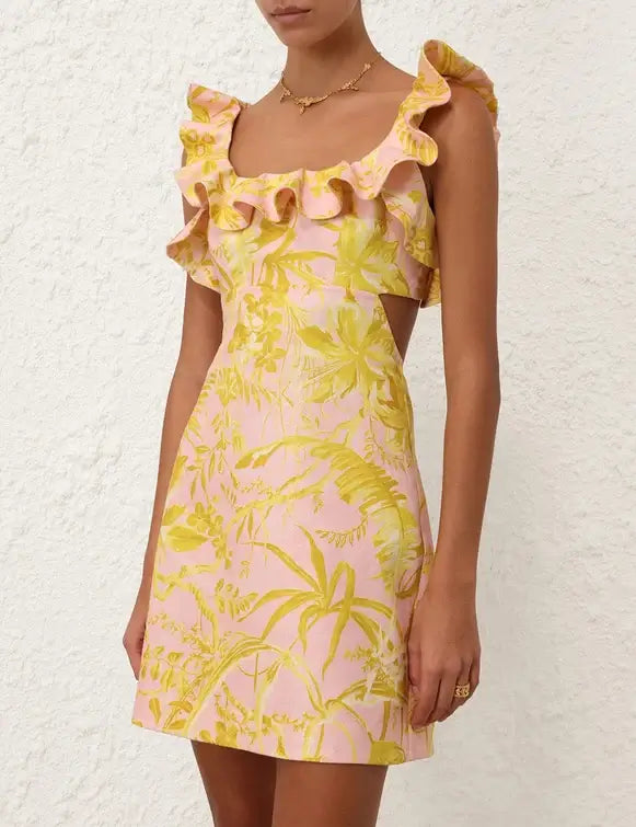 Model wearing and showcasing Linen mini dress wide shoulder straps with ruffles and an elastic panel