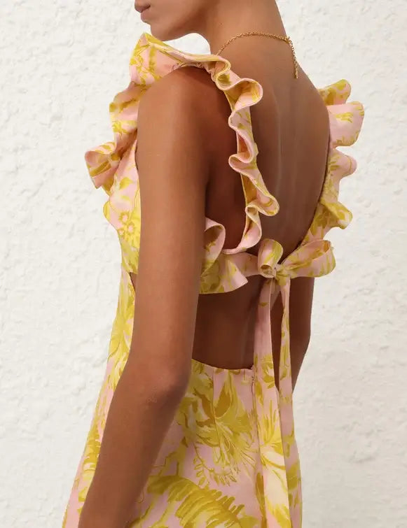 Self tie back of linen mini dress featuring shoulder and bodice ruffles with a self tie back